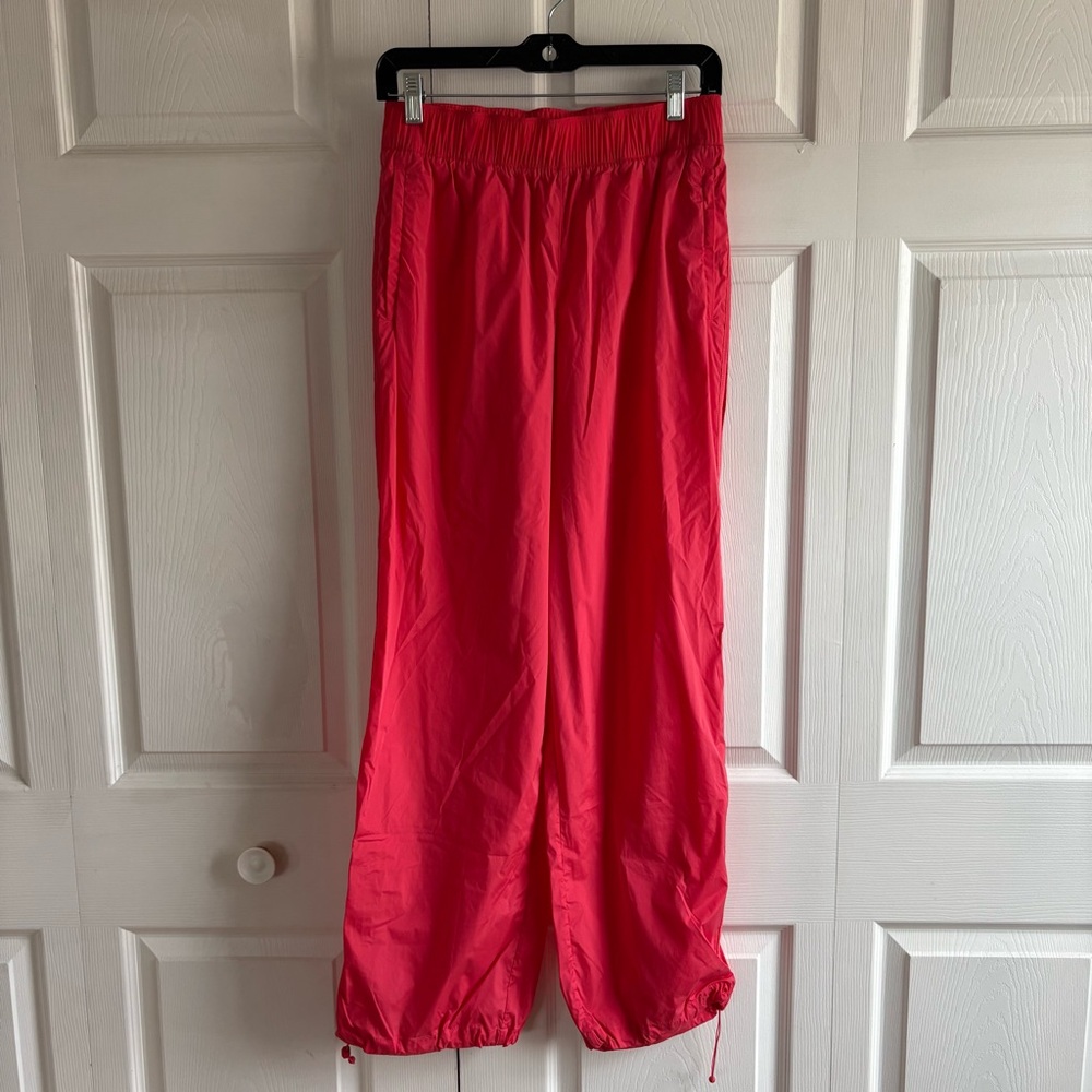ATHLETA Rise Pant XS Punch Bungee Hem Zip Pocket Nylon Blend Run Gym Hiking Pink